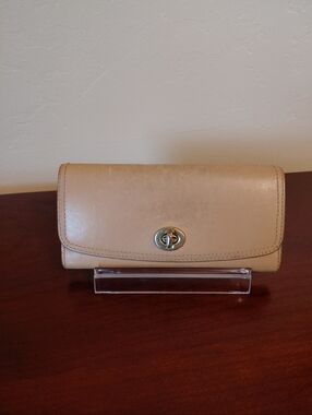 Coach Vintage Legacy Continental Turn-lock beige soft leather wallet.